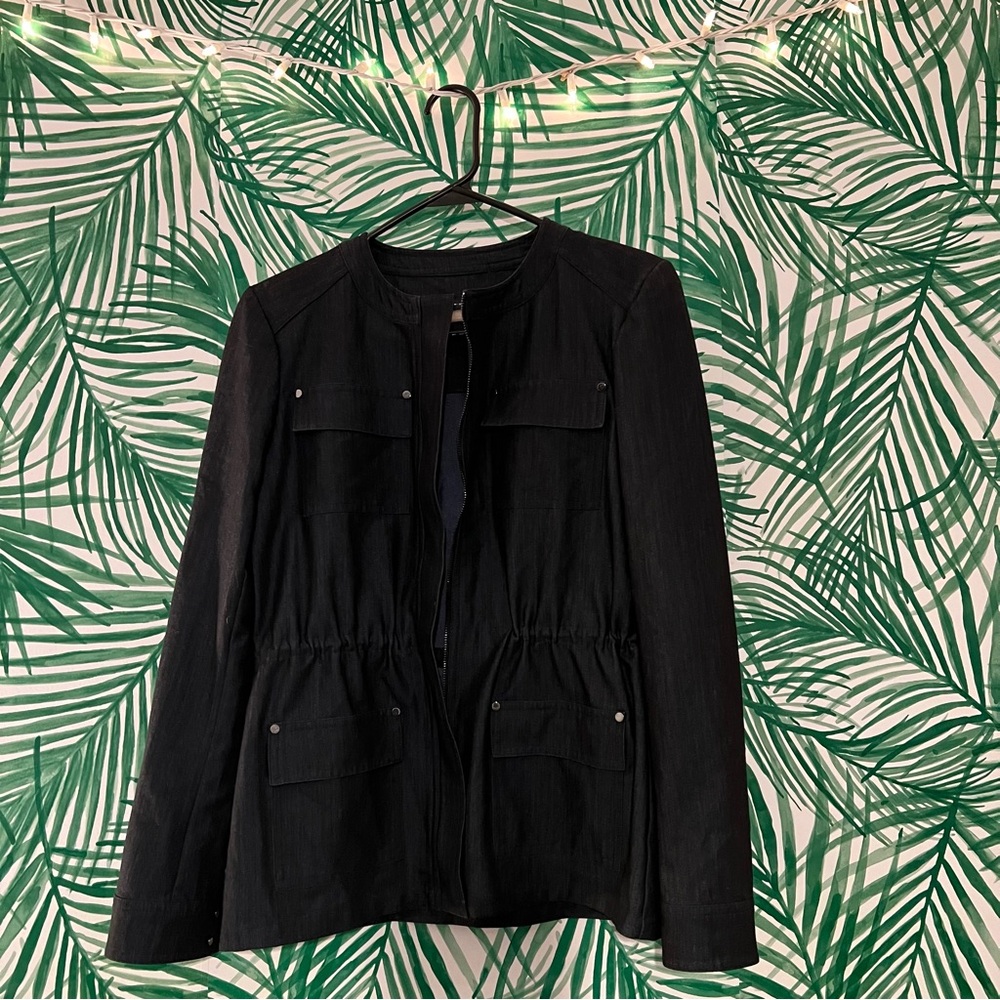 Tommy Hilfiger dark denim jacket with pockets and drawstring waist.